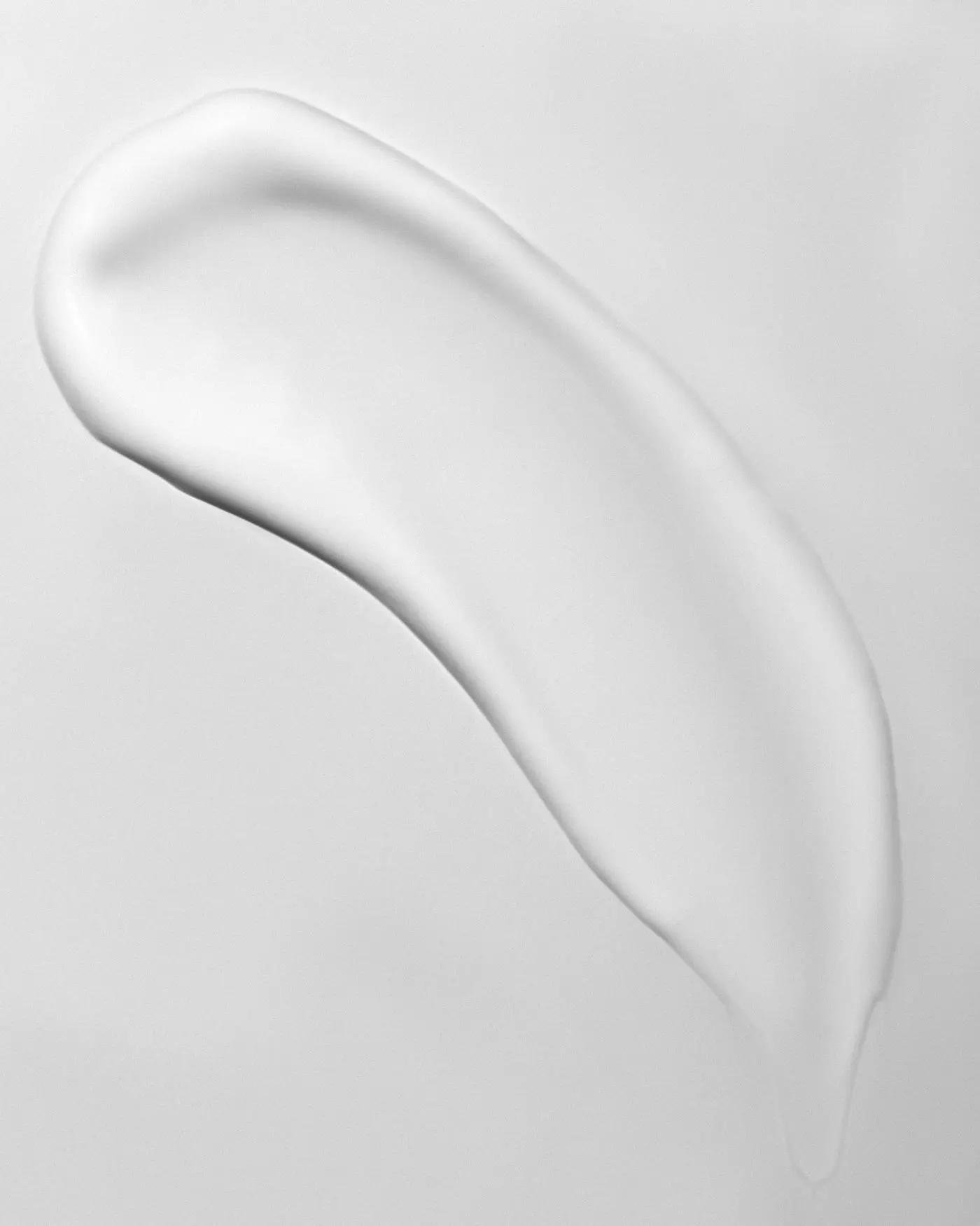 A close-up of a white skincare cream's texture